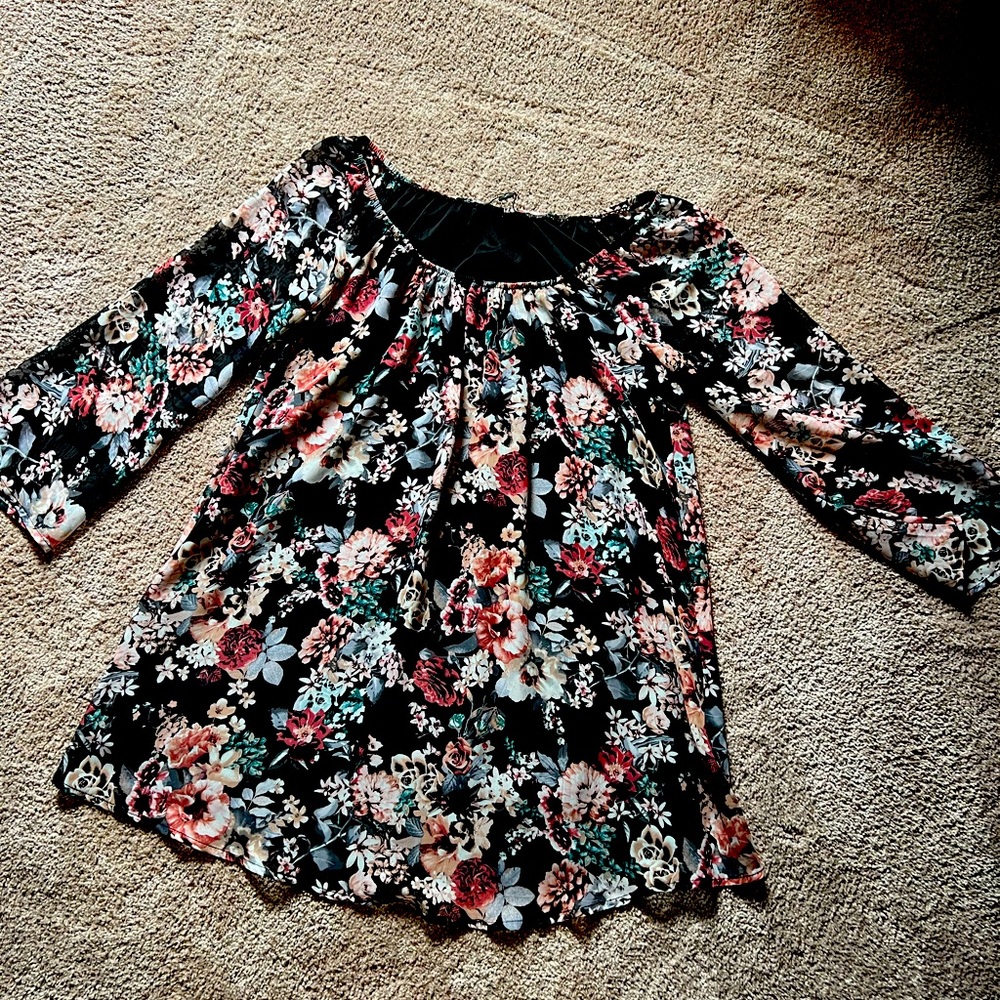 Floral off the shoulder mini dress with bell sleeves.